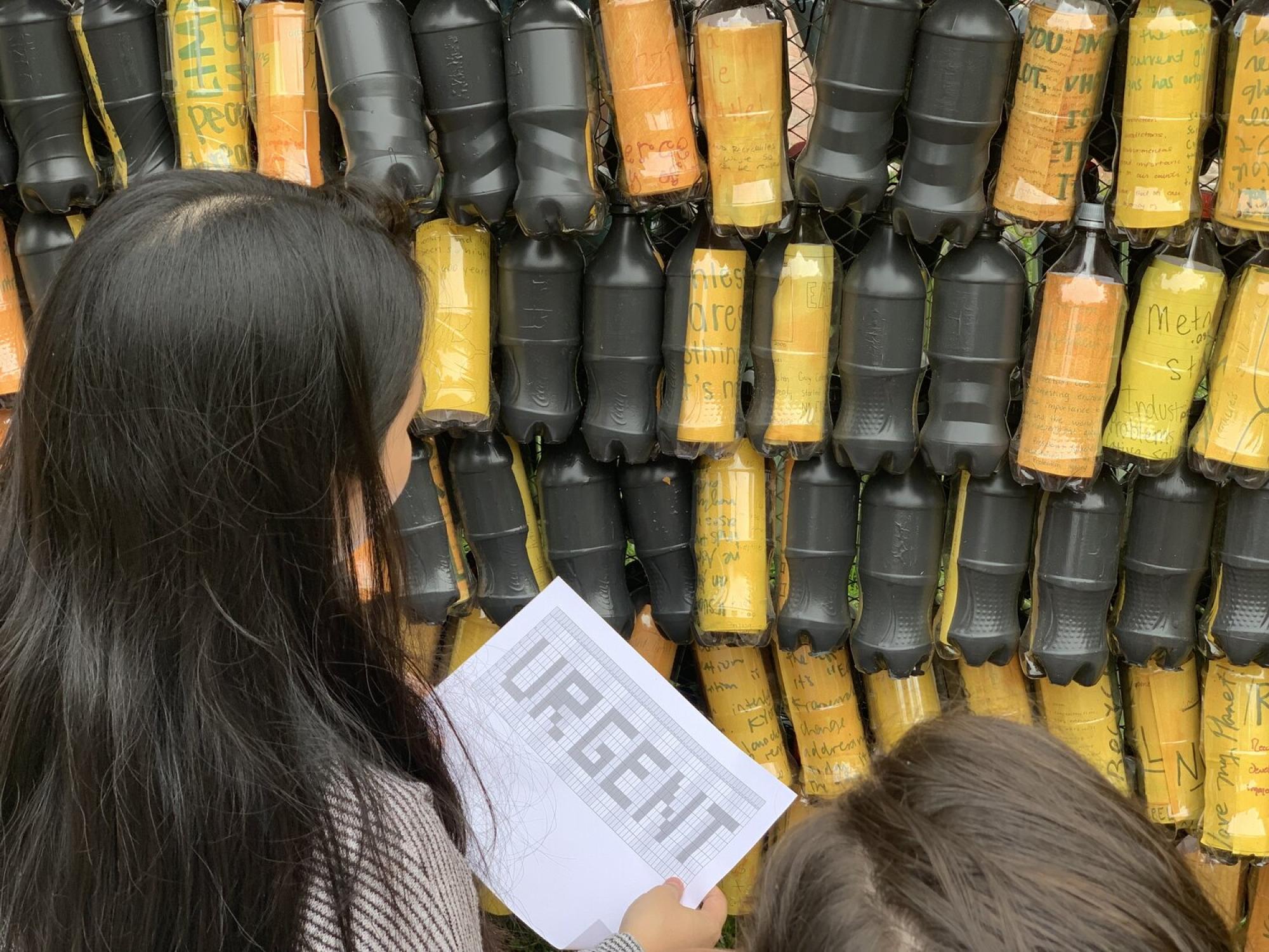 Each bottle could be used like a pixel to spell out short messages, phrases, and even images. These messages were changed out periodically by Write Climate volunteers and the public. The messages were often designed to coincide with Climate events like Earth Day and Climate Marches. 